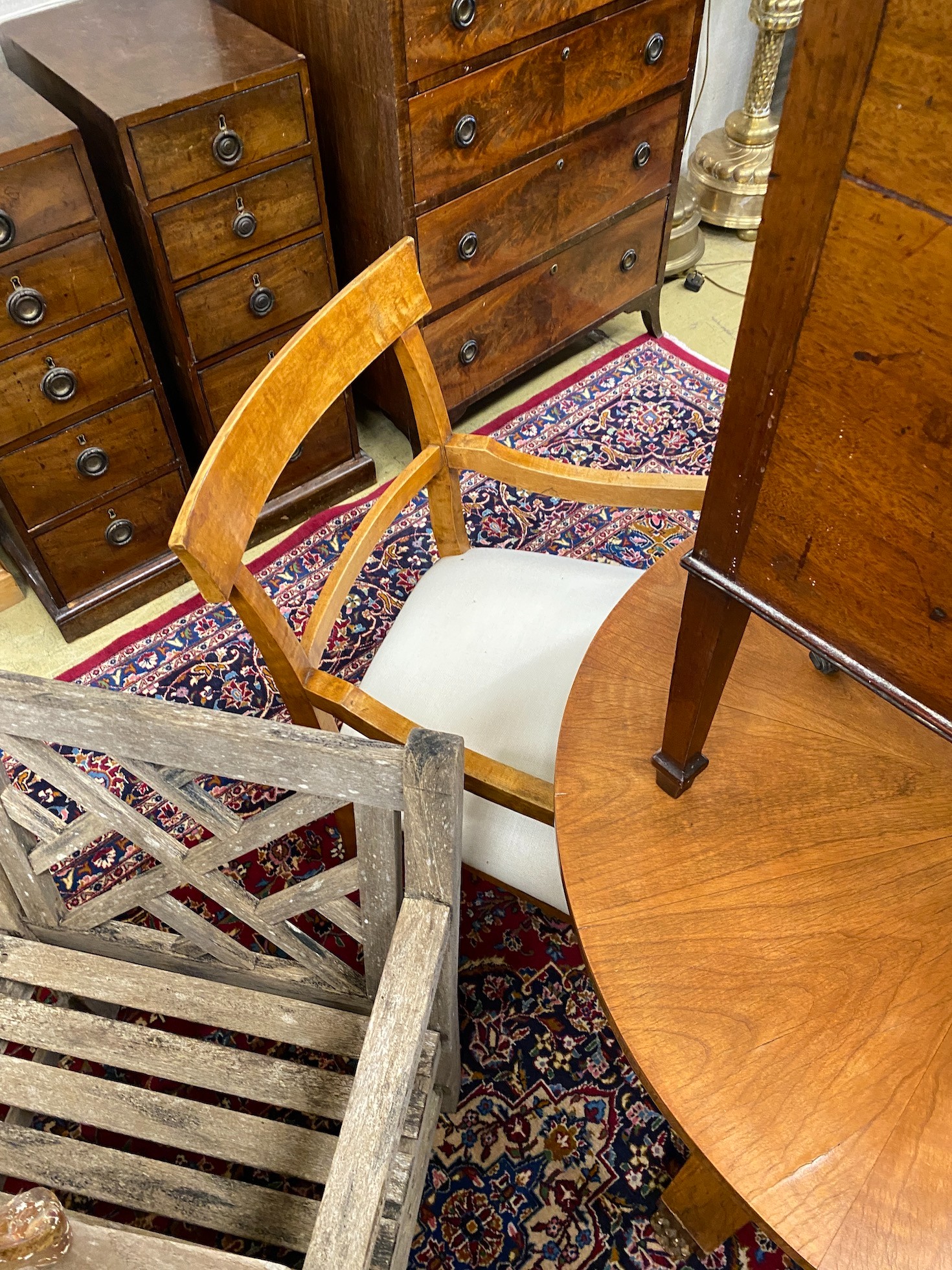 A Biedermeier style circular breakfast table, diameter 91cm, height 75cm, and a pair of elbow chairs